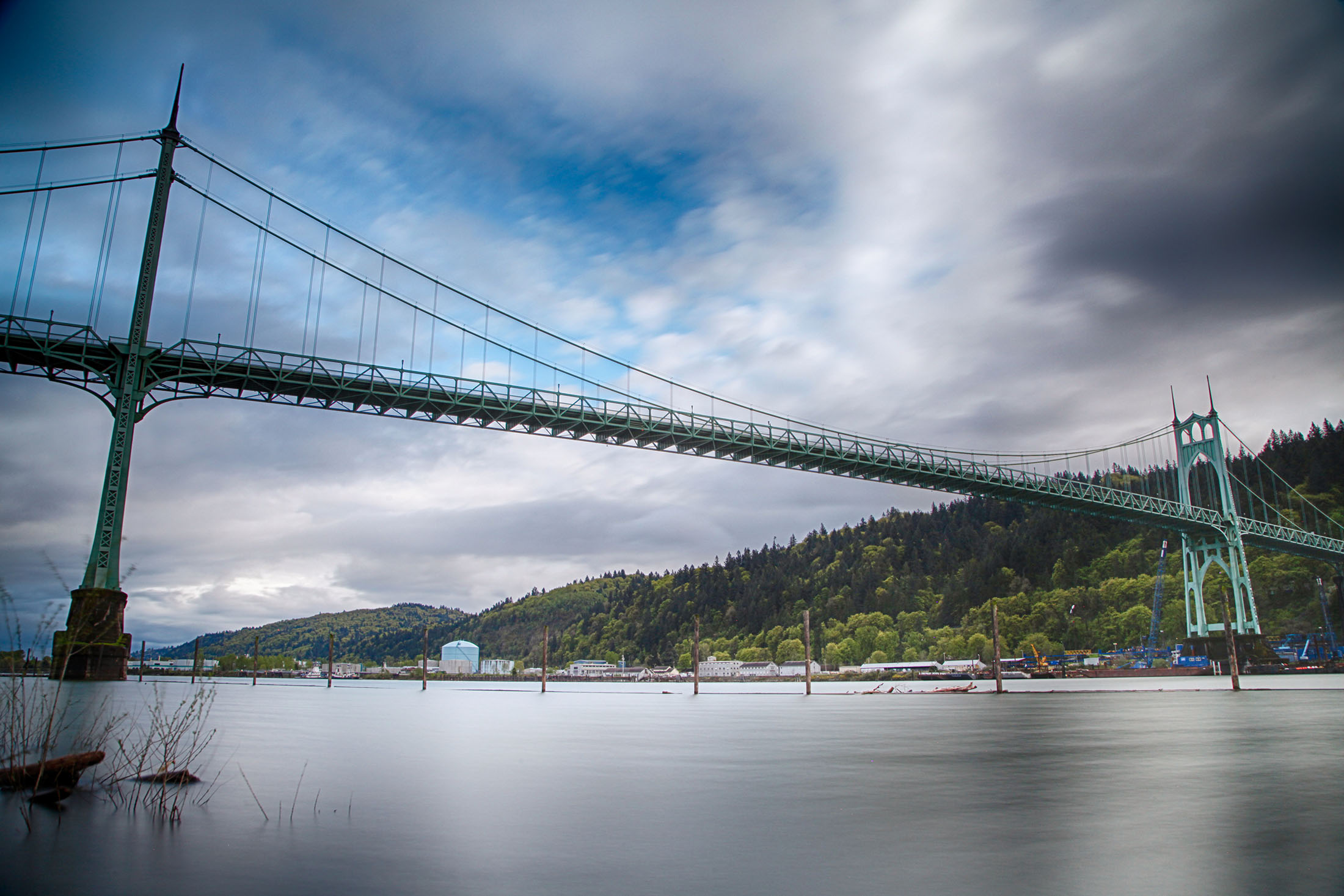 A view of the St Johns Bridge from river level. The CEI hub can be seen in the distance across the river.